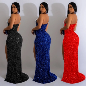 Detailed view of backless sequin evening gowns in black, royal blue and red with high slits