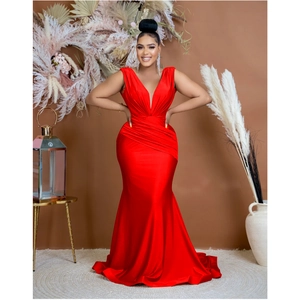 Close-up showing the elegant waist ruching detail on this red V-neck mermaid dress