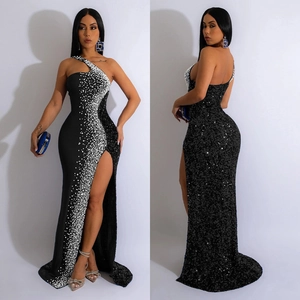Elegant one-shoulder black evening gown with silver sequins and high side slit floor length