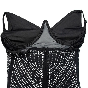 Detail of black mesh dress showing silver sequins, rhinestones and back zipper closure