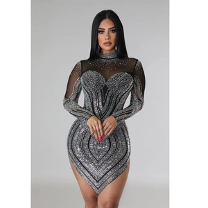 Detail of black mesh dress with shimmering silver rhinestones in heart patterns