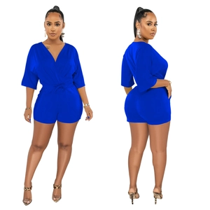 Detail view of royal blue V-neck romper with drawstring waist and medium sleeves