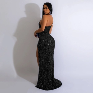 Detail of elegant black sequin evening dress featuring a high slit and backless design
