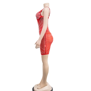 Detail of red bodycon mini dress with white rhinestones in geometric patterns