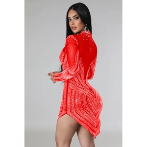 Close-up of red rhinestone mesh mini dress featuring asymmetrical hem and long sleeves