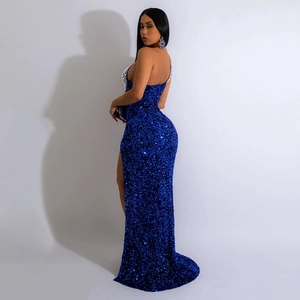 Detail of royal blue sequin dress featuring side slit and sparkling rhinestone accents