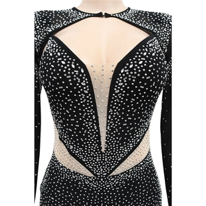 Detail of black rhinestone mini dress featuring mesh patchwork and hollow-out neckline