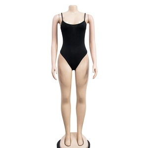 Close-up of black mesh bodysuit with fine straps and high-cut leg on a mannequin