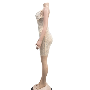 Detail of nude mesh bodycon dress with rhinestone patterns and thin spaghetti straps