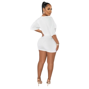 Detailed back view of a white high-stretch knit two-piece set with a T-shirt and shorts