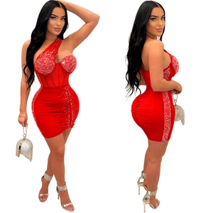 Detail of red one-shoulder bodycon dress with sparkling rhinestones and ruched texture