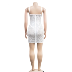 Detailed back view of white bodycon dress with sparkling silver rhinestones and zipper