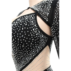Close-up of mesh fabric with silver rhinestones and sequins on a black bodycon dress