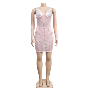 Detail of pink bodycon dress featuring sparkling silver rhinestones and mesh fabric