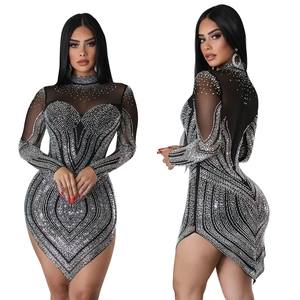 Detail view of black mesh mini dress with sparkling silver rhinestones in geometric patterns