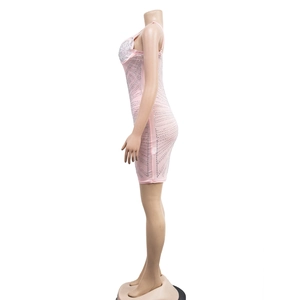 Detail of pink bodycon mini dress with wavy rhinestone patterns and thin spaghetti straps