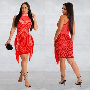 Detail view of red sleeveless mini dress with rhinestone geometric patterns and long fringes