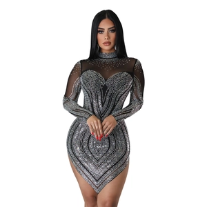 Detail of silver rhinestones and mesh fabric on a black bodycon mini dress