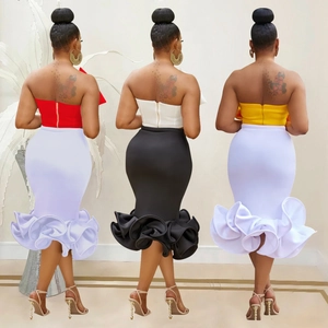 Detail of two-piece fishtail skirt set with strapless tube top and ruffled hem design