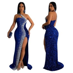 Detail of royal blue sequin evening gown with rhinestone pattern and high side slit