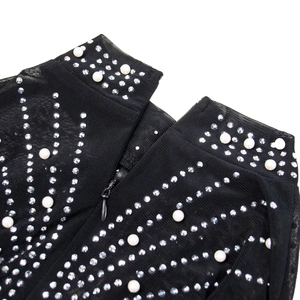 Detailed view of sheer mesh dress with rhinestones, pearls and an invisible zipper back