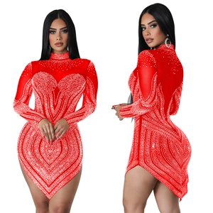 Detail view of red mesh bodycon dress featuring rhinestone heart pattern and mini length