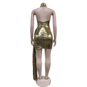 Detail view of the backless gold metallic halter mini dress with side sash and zip