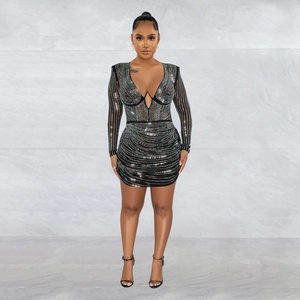 Detail of a sexy black long sleeve mini dress featuring shimmering silver rhinestones