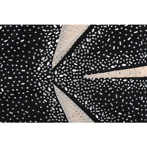Detail of mesh dress featuring geometric nude patchwork and sparkling rhinestones