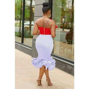 Rear view of women's red tube top with zipper and white high waist fishtail skirt