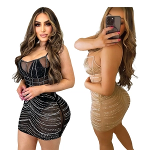 Women's party dress with sequins and sheer mesh panels in black and gold colors
