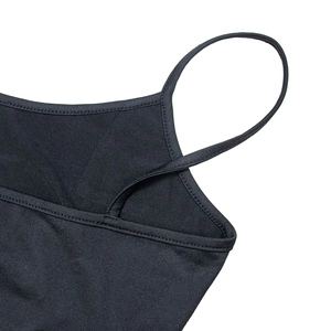 Macro shot of durable shoulder strap stitching on a black mesh dress inner camisole
