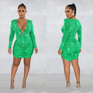 Elegant emerald green mesh mini dress with sequins, deep V-neck and ruched bodycon fit
