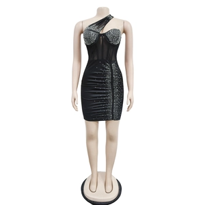 Detail of black one-shoulder mini dress with mesh patchwork and rhinestone embellishments