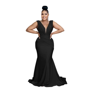 Detail of the high waist pleats and fishtail hem on this black V-neck evening gown