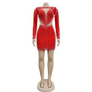 Detail of red mesh mini dress featuring crystal rhinestones and heart-shaped cutouts