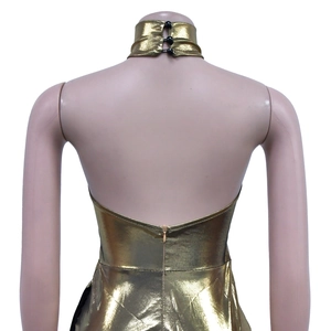 Close-up of gold metallic halter top back with three black bead buttons and invisible zipper