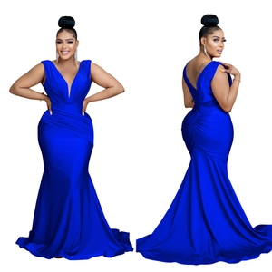 Detail of royal blue v-neck maxi dress featuring waist pleats and fishtail hemline