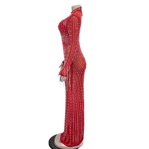 Detail of red sheer mesh dress with elegant white sequin vertical patterns and high neck