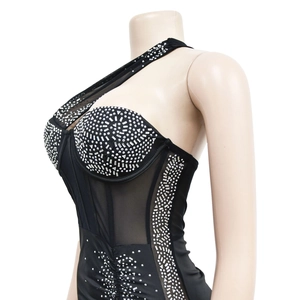 Detail of silver rhinestones and sheer mesh on black one shoulder bodycon dress