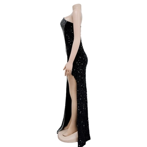Detail view of black sequin evening gown with shimmering rhinestones and a high side slit