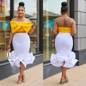 Fashion two-piece set with yellow bow tube top and white fishtail skirt for parties