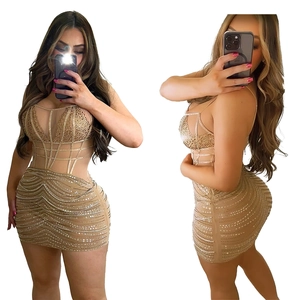 Detailed view of champagne gold bandage dress with rhinestones and mesh waist inserts