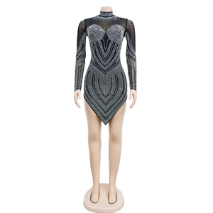 Close-up of black mesh dress featuring silver rhinestones in a V-shaped geometric pattern