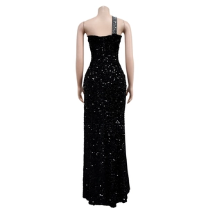Close-up of the back view showing black sequins and rhinestone strap on the evening gown