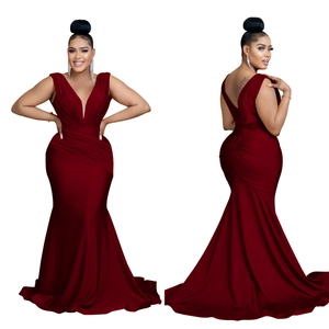 Detail of burgundy V-neck maxi dress with elegant pleats and fish-tail train