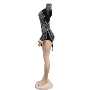 Detail of black mesh bodysuit featuring sparkling silver rhinestones and high neck design