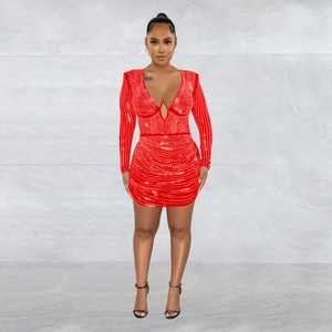 Detailed view of red bodycon dress with sparkling rhinestones and a deep V-neckline