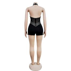 Back view of black halter romper with rhinestones and mesh detailing on the waist and back