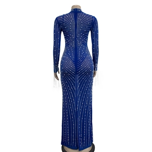 Detail of blue mesh dress back showing sparkling rhinestone patterns and zipper closure